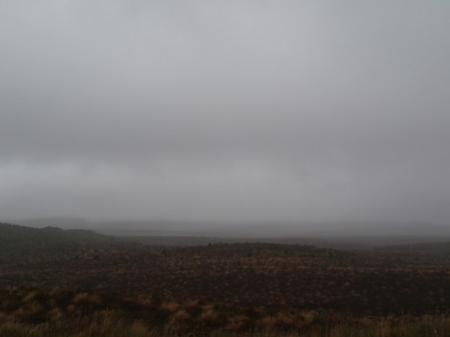 Mount Doom is hiding behind grey clouds in the morning. We'll be back!